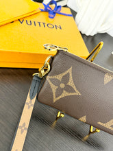 Load image into Gallery viewer, LOUIS VUITTON 2023 Monogram Giant Rectangular Wristlet Pouch
